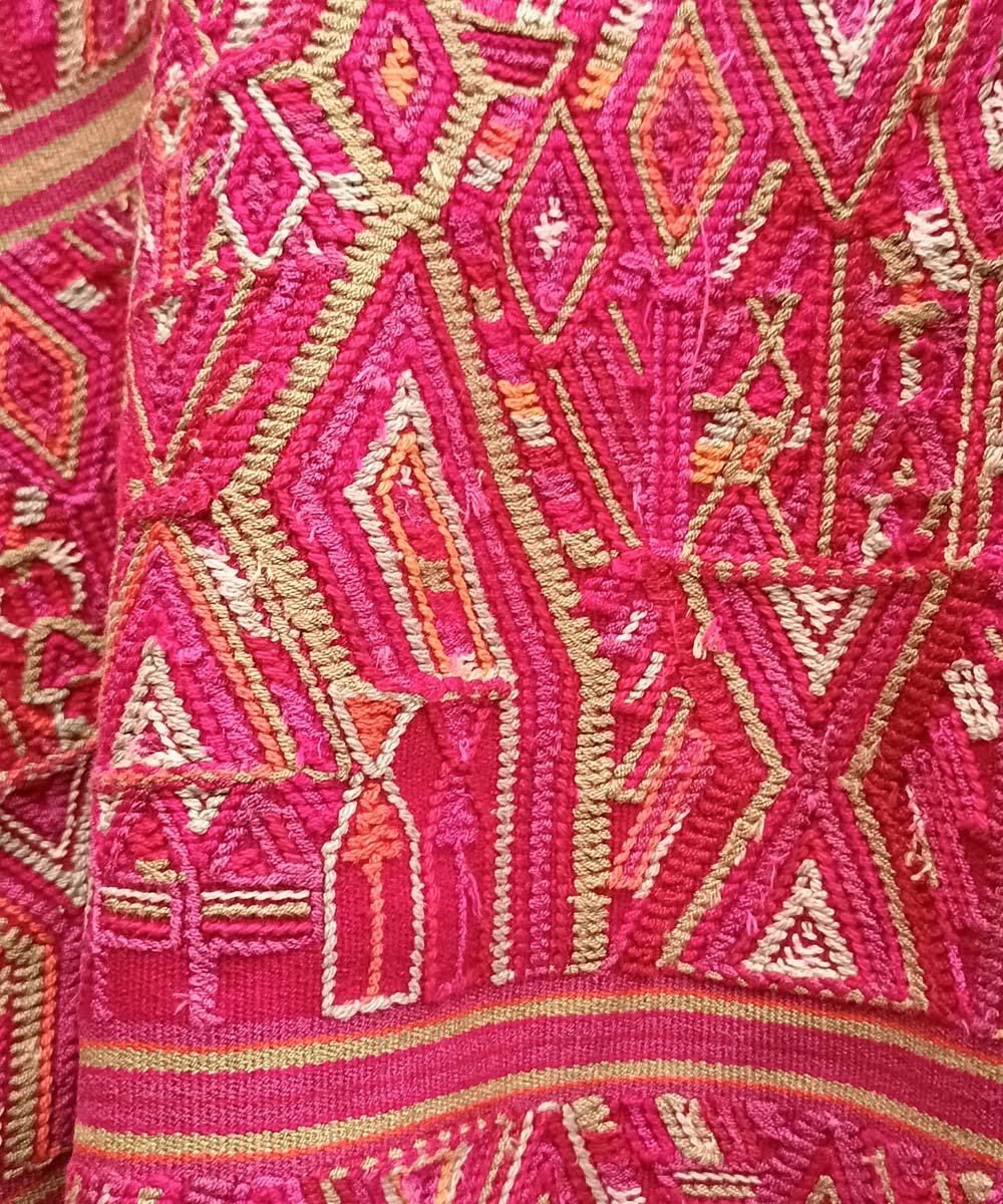 Bright red Nebaj huipil with fringe