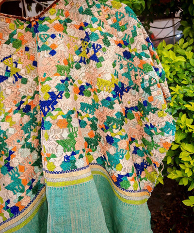 Green and peach Coban huipil