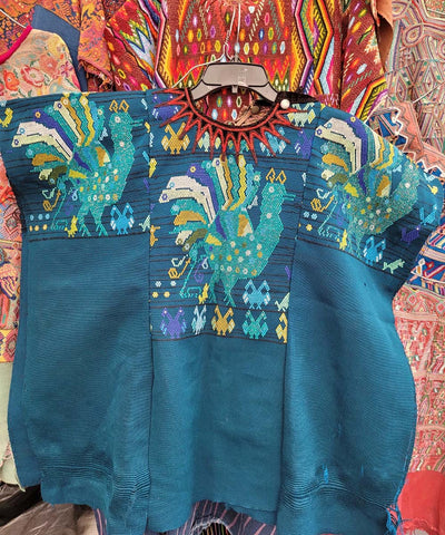 Teal blue Chichi huipil with peacocks