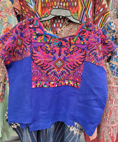 Pink and blue Chichi huipil with birds