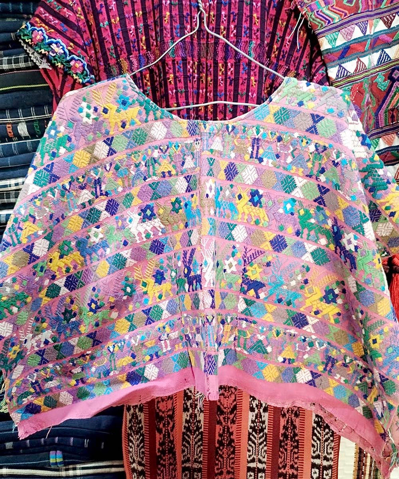 Pink and blue Coban huipil
