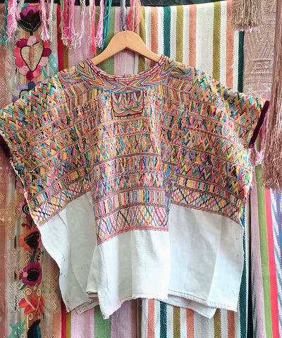 Colorful on white San Juan Cotzal huipil