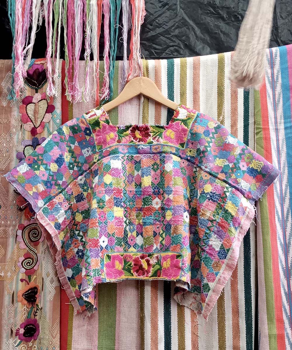 Colourful Coban huipil with floral feature