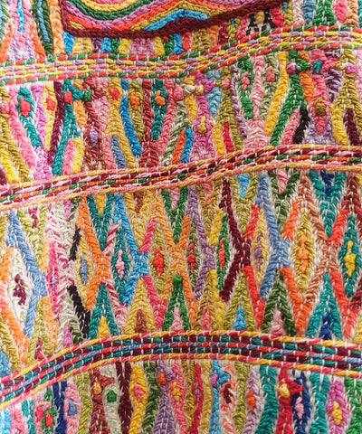 Colorful on white San Juan Cotzal huipil