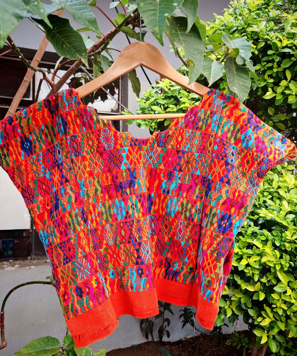 Colorful orange Coban huipil