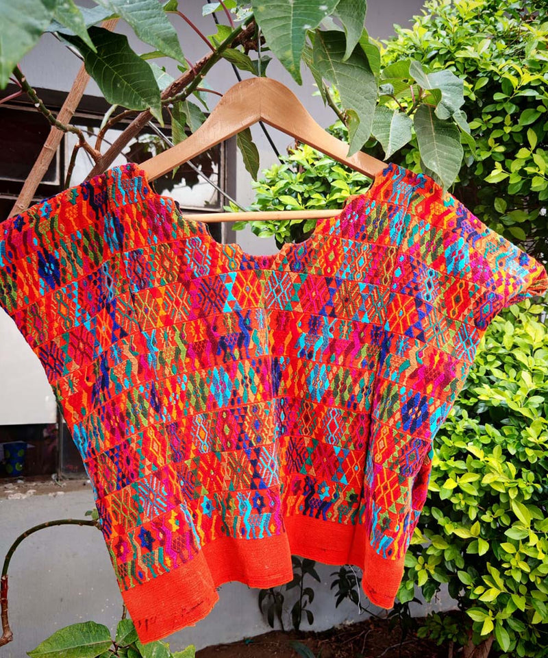 Colorful orange Coban huipil