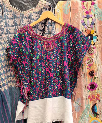 Blue and pink Nebaj huipil with birds