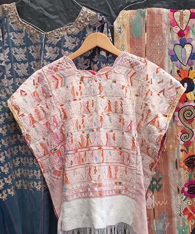 Blush and orange San Juan Cotzal huipil