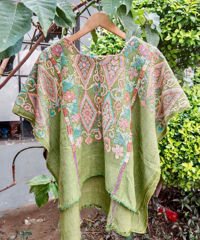 Pale green and pink Chichi huipil