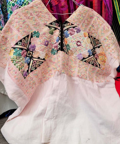 Pastel Nahuala huipil with colorful geometrics