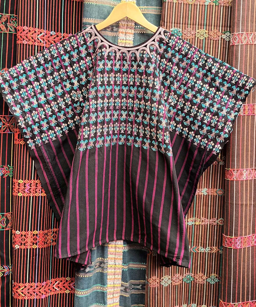 Black and pink Nahuala huipil with turquoise puppies