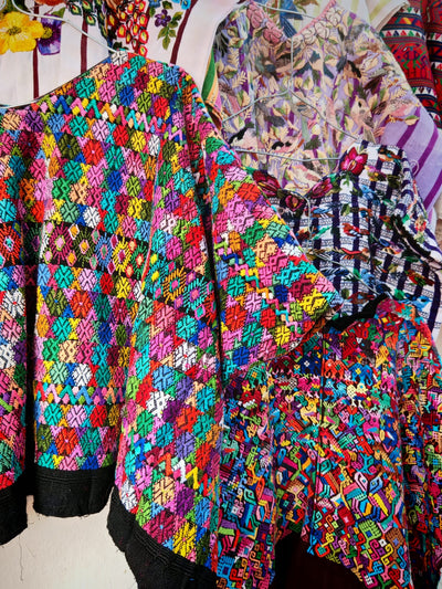 Colourful Coban huipil on black cotton