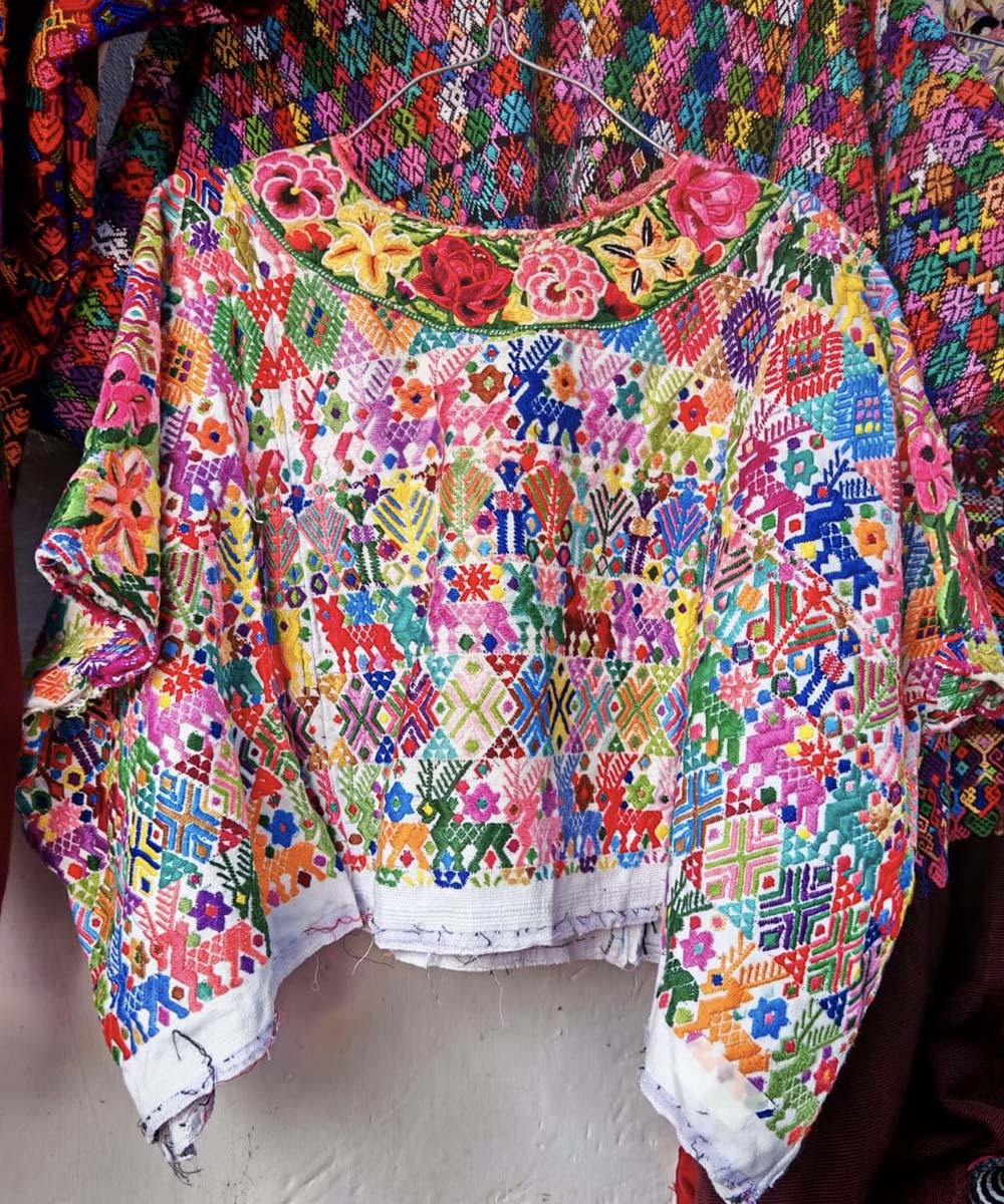 Colorful on white Coban huipil