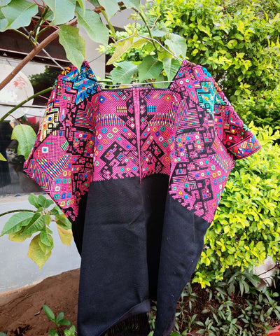 Pink and black Nahuala huipil