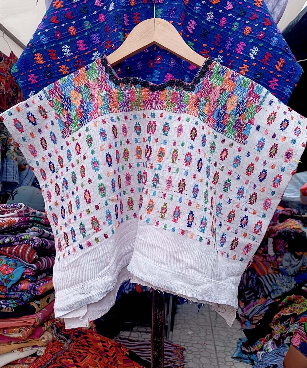 Colorful on white Coban huipil