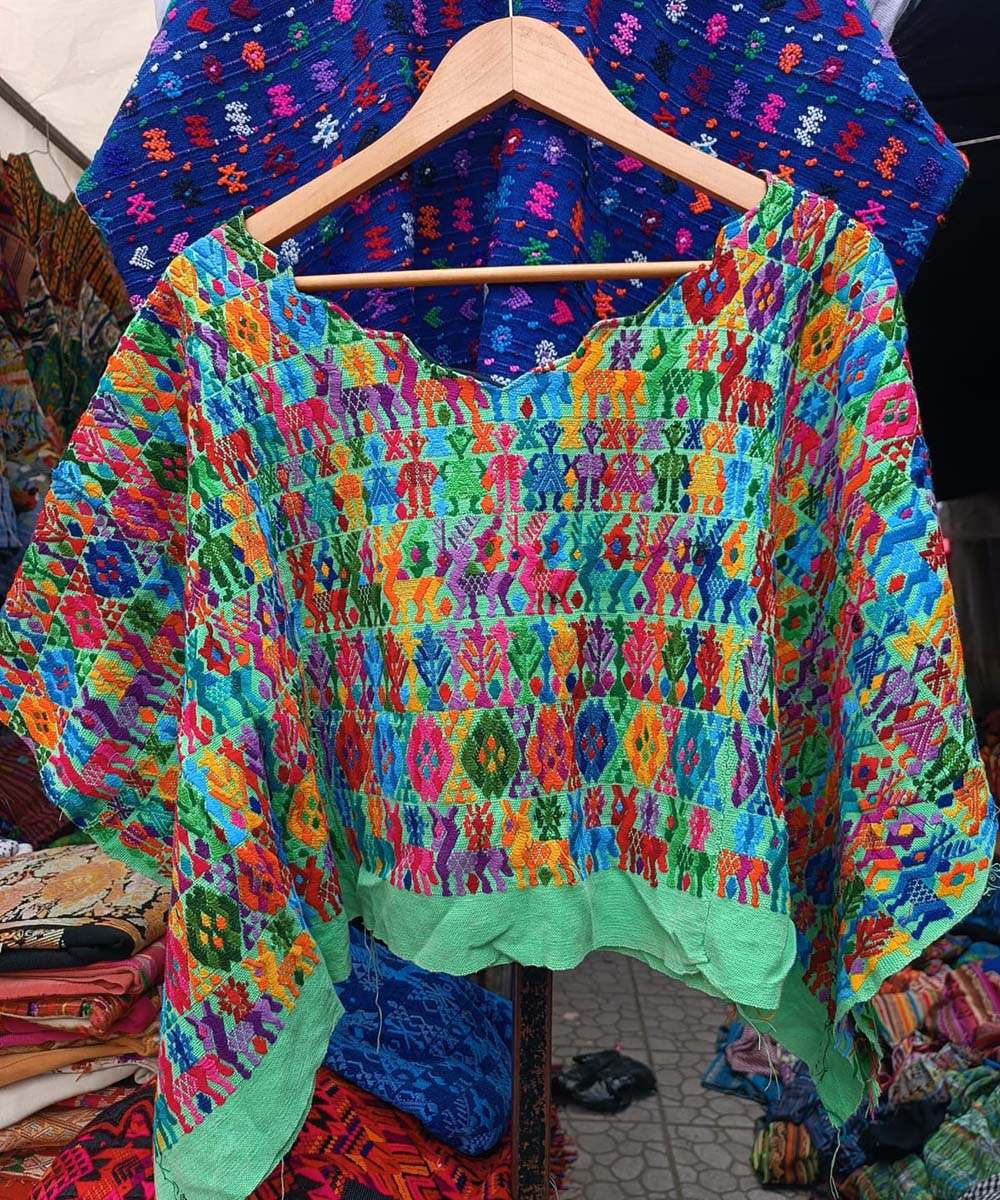 Colourful on pistachio green Coban huipil