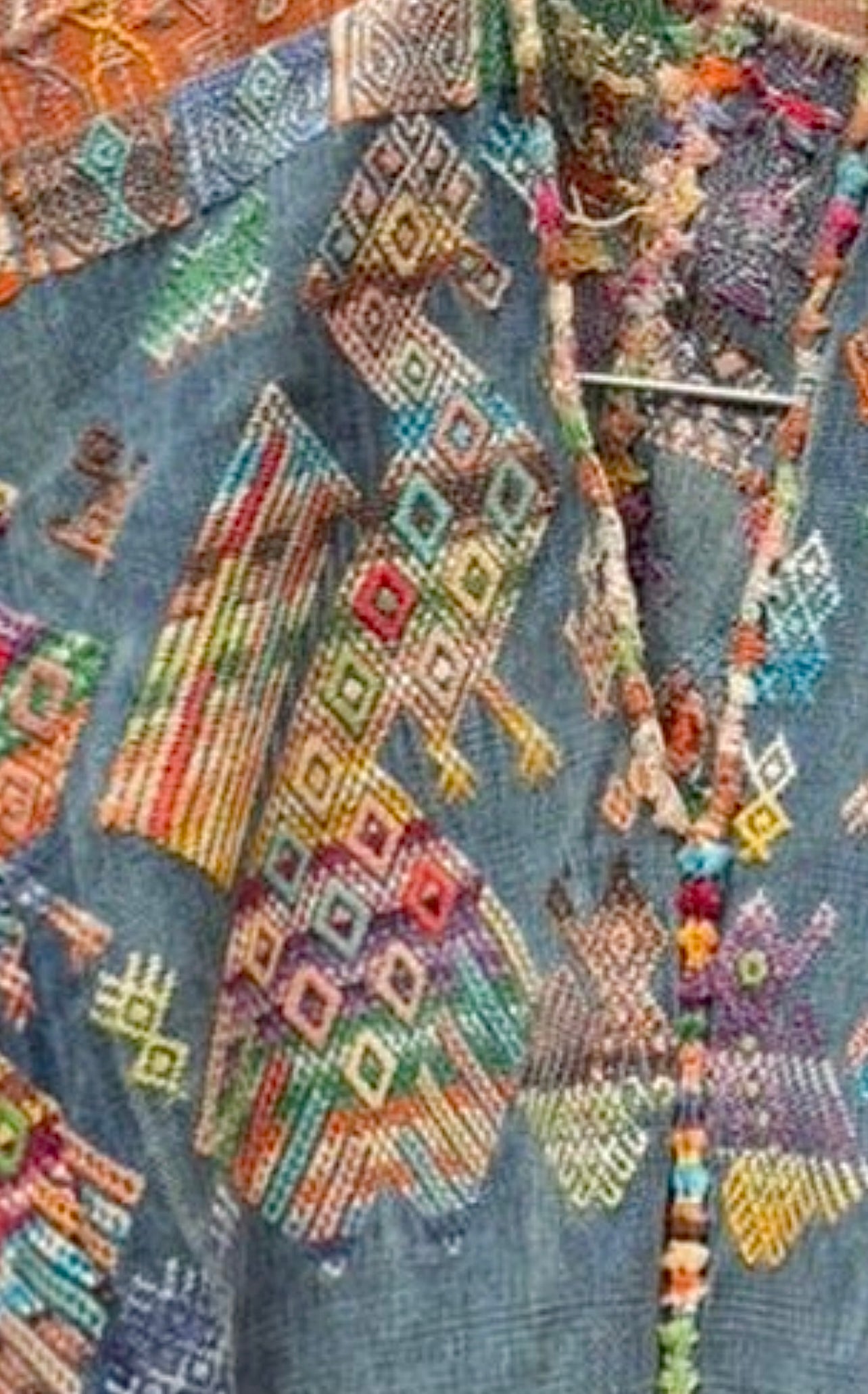 Indigo Nahuala huipil with colorful peacocks