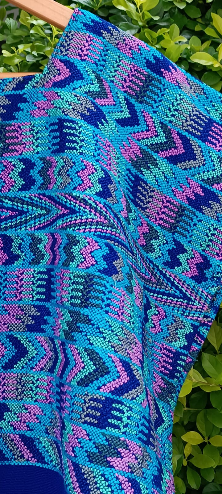 Bright blue and pink Comalapa huipil