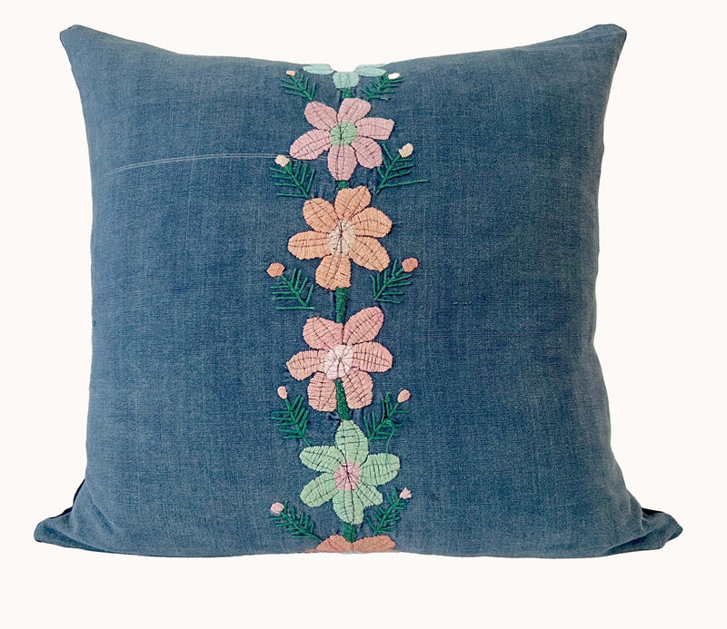 Embroidered Guatemalan huipil textile repurposed into a pillow