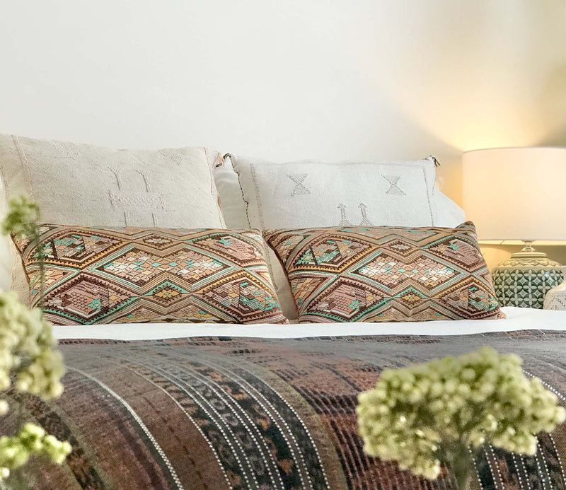 Embroidered Guatemalan huipil textile repurposed into a pillow