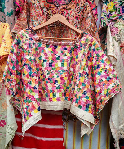 Colorful on white Coban huipil