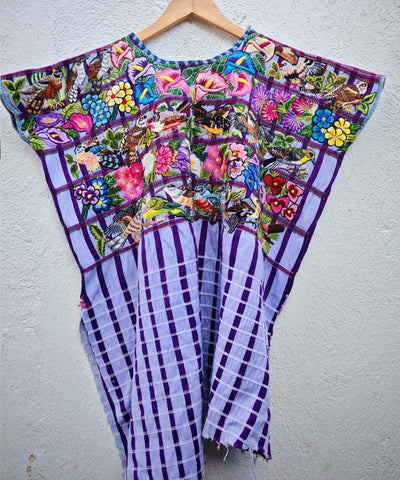 Lilac Santiago huipil with an embroidered garden