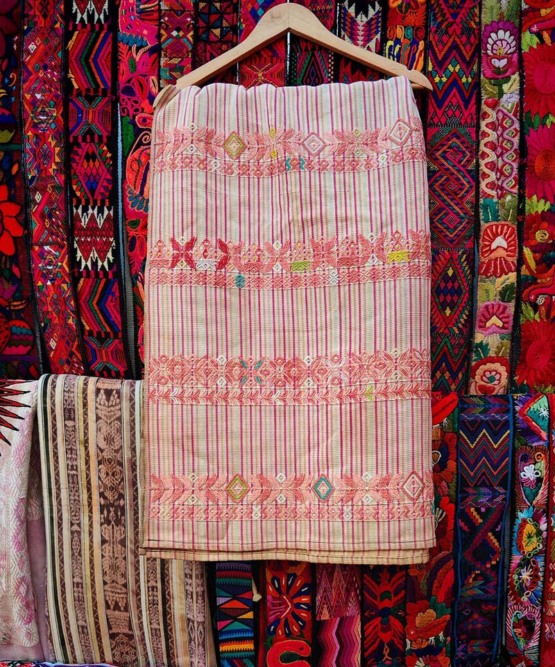 Shop over 150 Guatemalan huipiles being sold at the Chichicastenango markets. Authentic vintage embroidered blouses for sale online with worldwide shipping