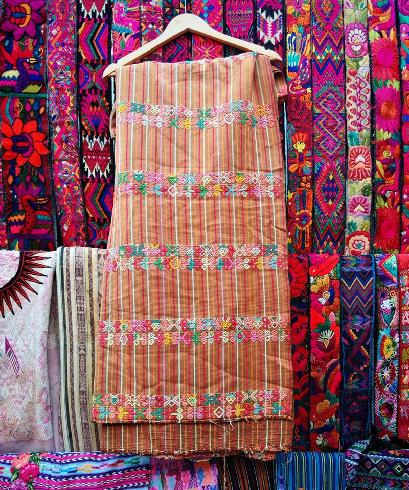 Shop over 150 Guatemalan huipiles being sold at the Chichicastenango markets. Authentic vintage embroidered blouses for sale online with worldwide shipping