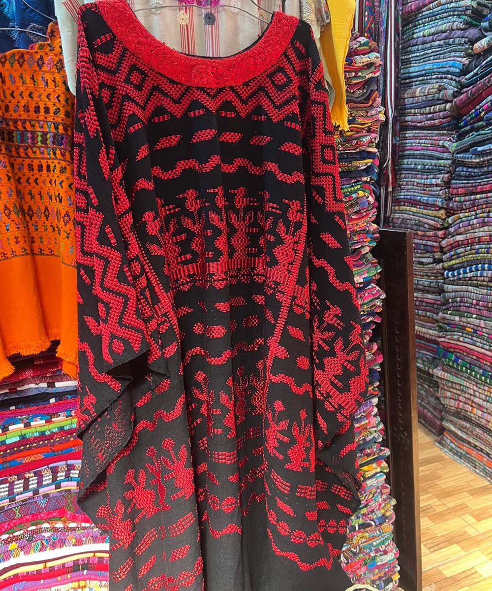 Red and black ceremonial huipil worn in parades