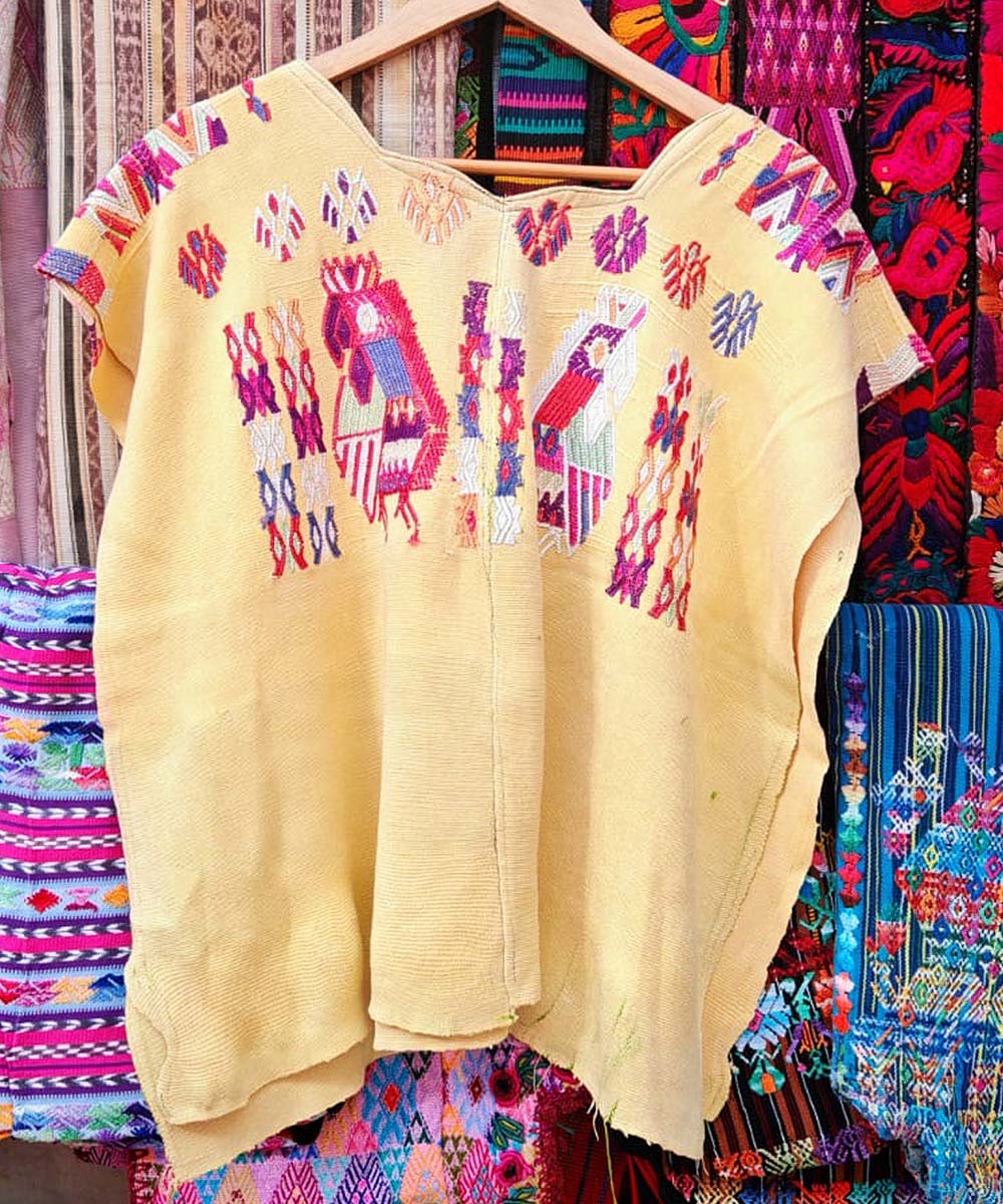 Guatemalan huipil from Chajul in yellow with bird motifs