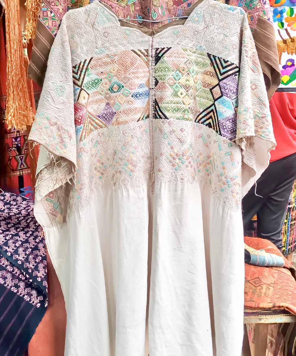 Long Nahuala huipil with pastel embroidery