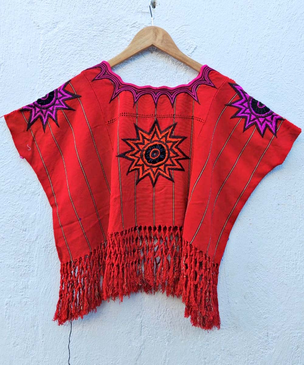 Bright red huipil with fringe