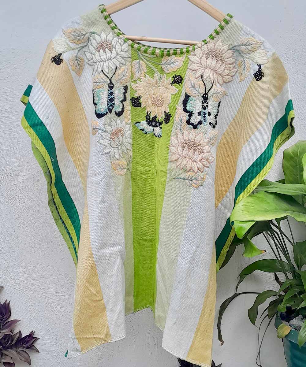 Green and cream floral Santiago huipil with butterflies