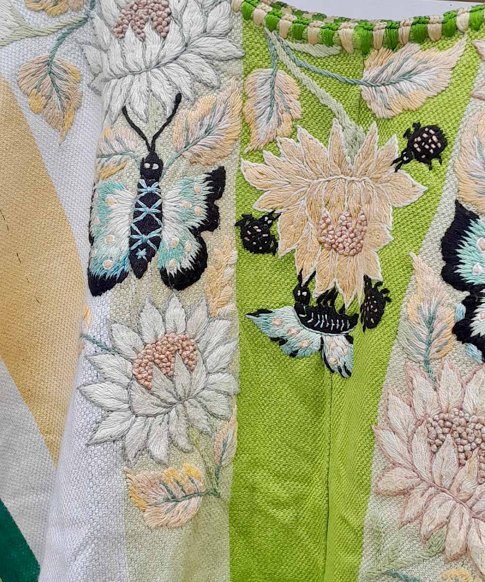 Green and cream floral Santiago huipil with butterflies