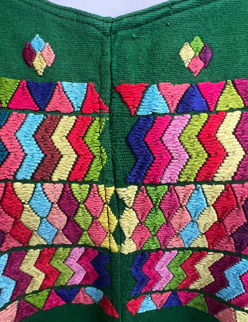 Light green background with geometric designs in different colors Chajul Huipil #8-342