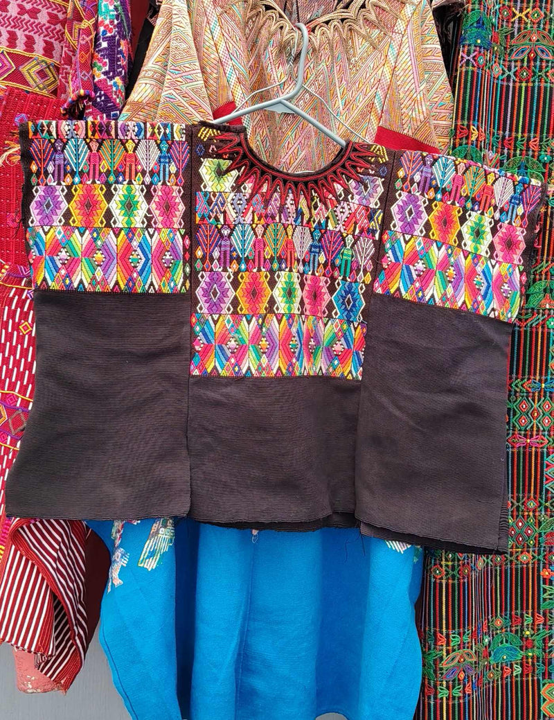 Black with Colourful Geometric pattern and person Chichicastenango Huipil #10-125