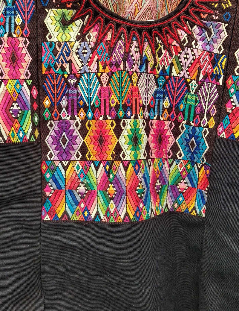 Black with Colourful Geometric pattern and person Chichicastenango Huipil #10-125