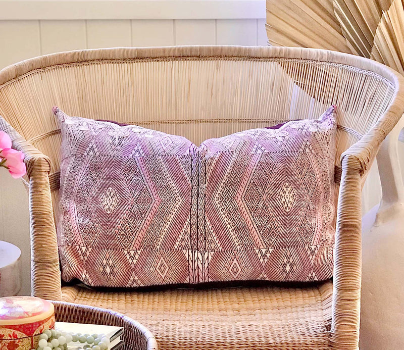 Guatemalan embroidered huipil pillow. Geometric chevron pattern in a pale pink palette.