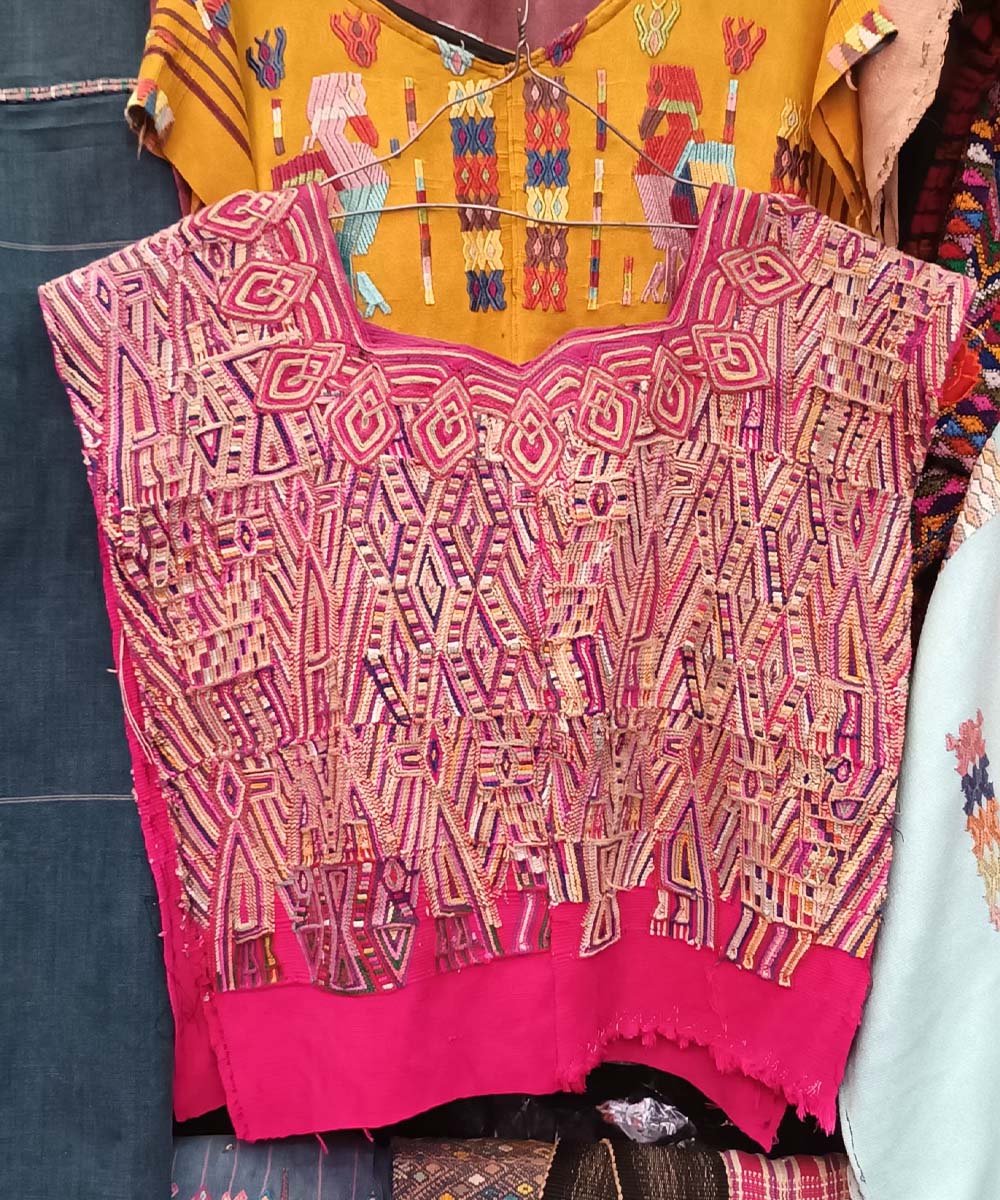 Pink and gold Nebaj huipil
