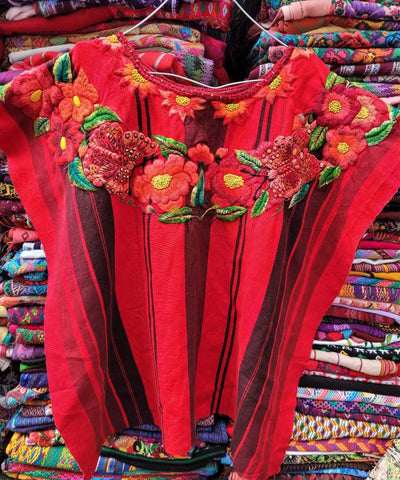 Bright red Santiago huipil with flowers