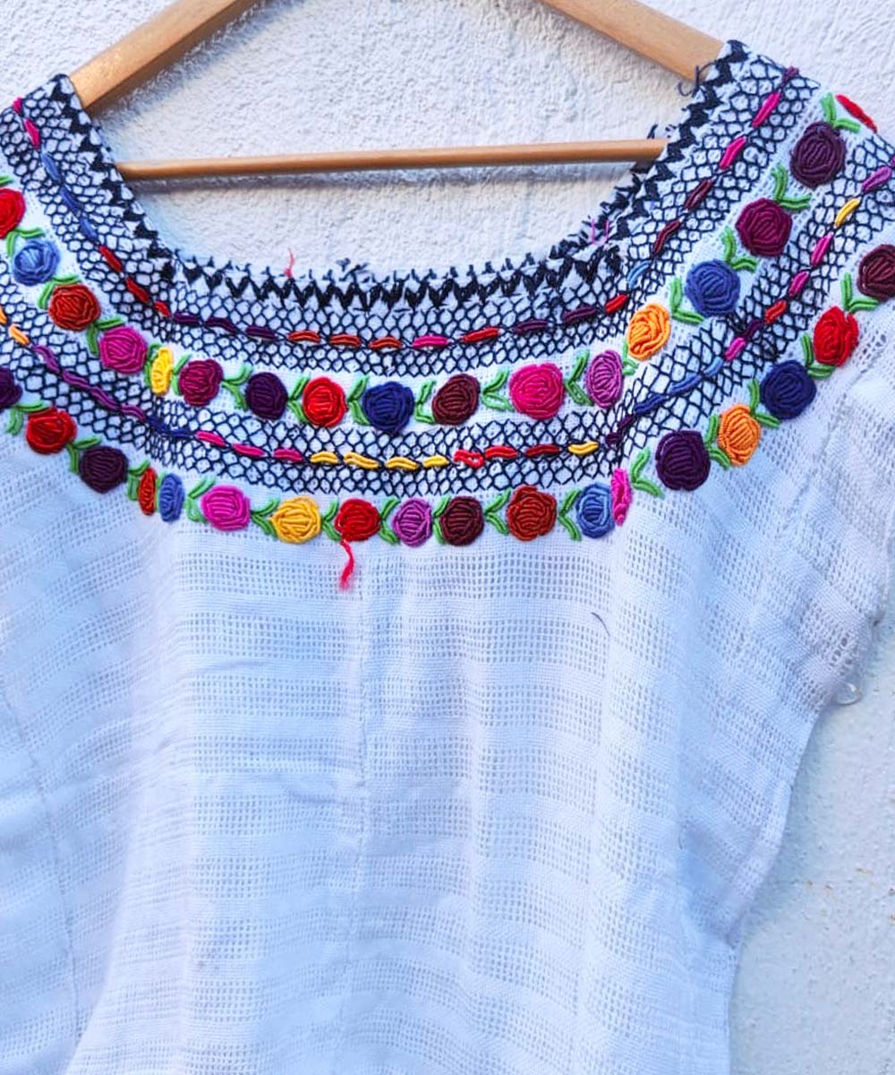 Sheer white huipil with colorful neckline