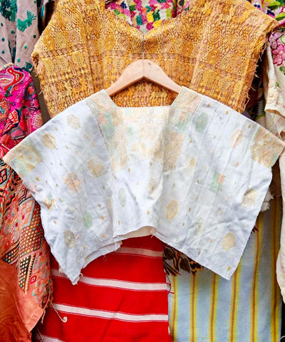 White Coban huipil with pale orange and green