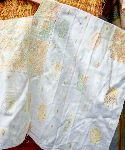 White Coban huipil with pale orange and green