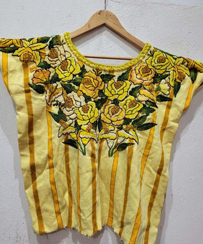 Yellow Santiago huipil with flowers