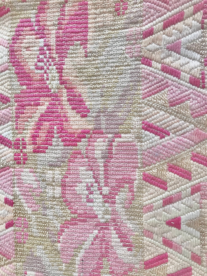 Guatemalan embroidered huipil pillow. Abstract flowers in a pale pink and white palette.