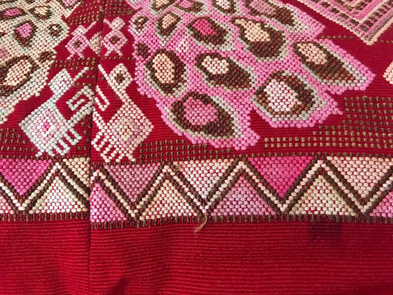 Guatemalan huipil pillow. A vintage textile with a red peacock bird design.