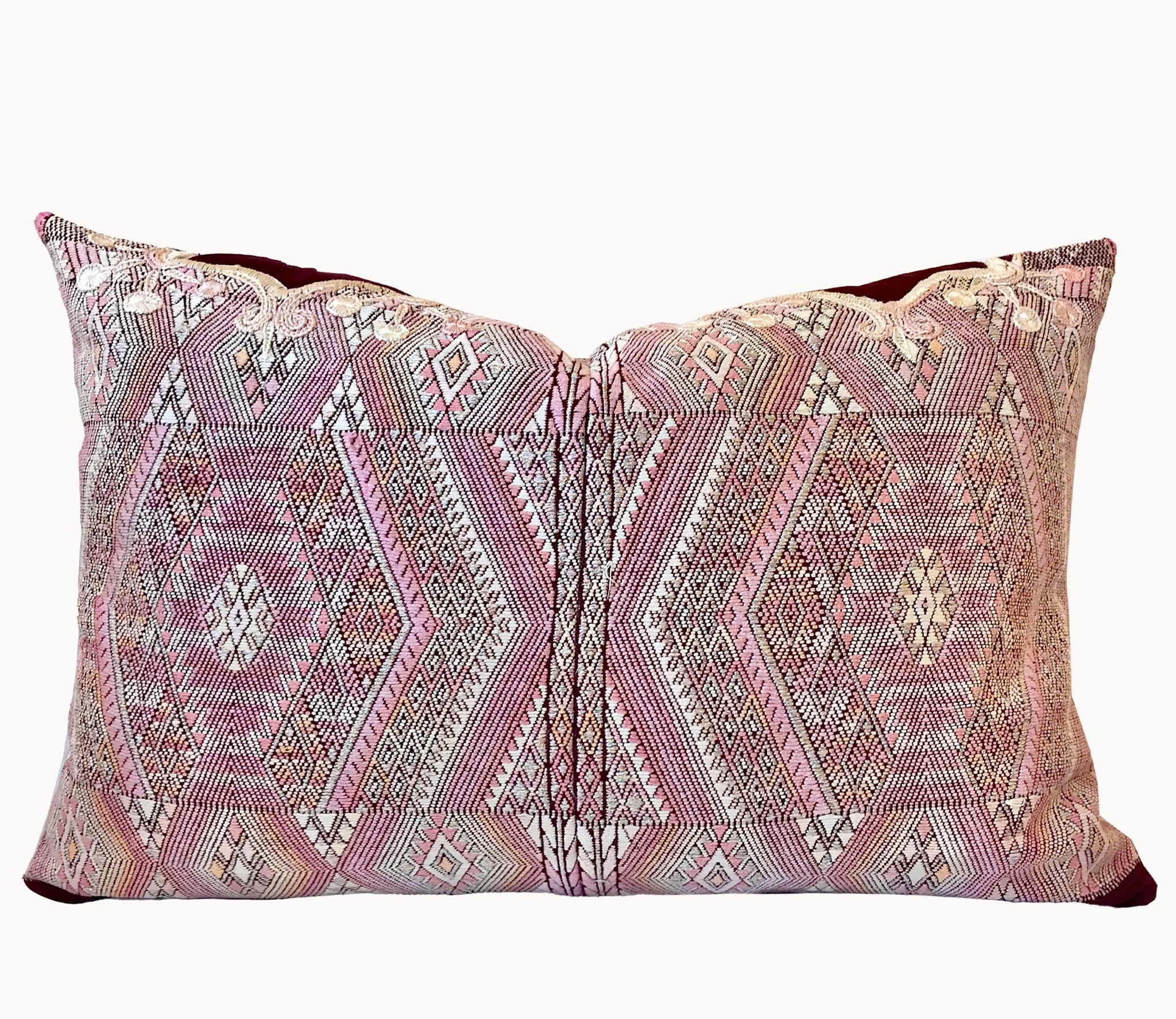 Guatemalan embroidered huipil pillow. Geometric chevron pattern in a pale pink palette.