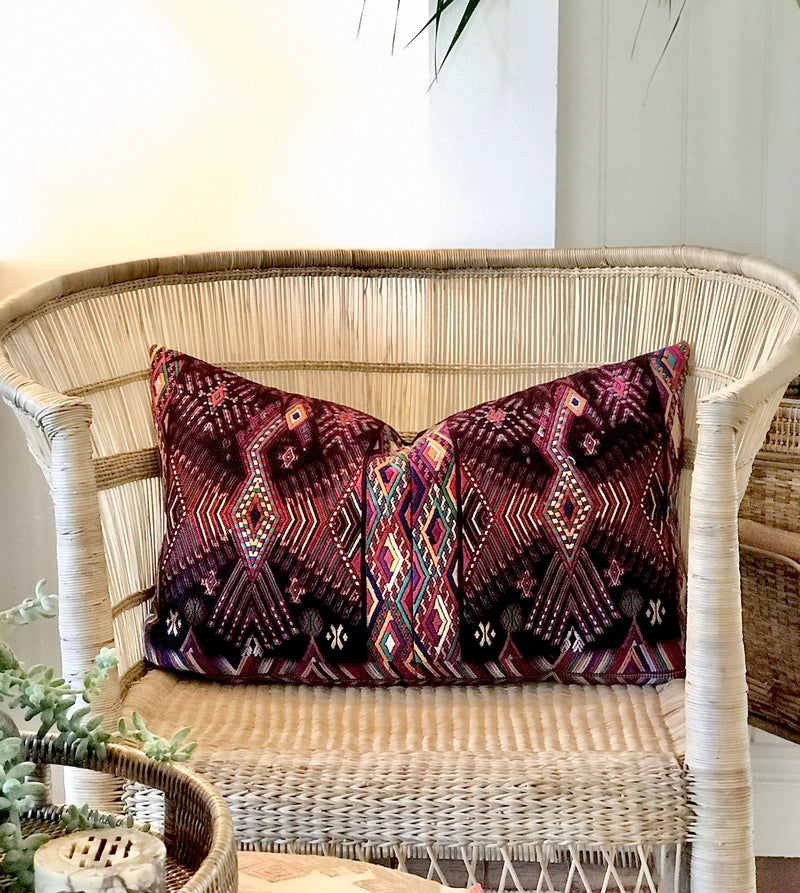 Guatemalan huipil pillow. A darkly exotic vintage textile with a stylised rising phoenix bird design.