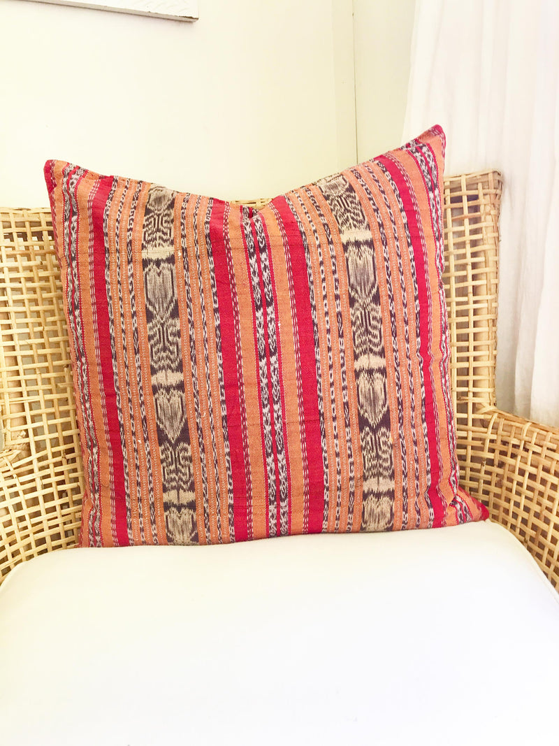 Vintage textile cushion made from a Guatemalan huipil and corte