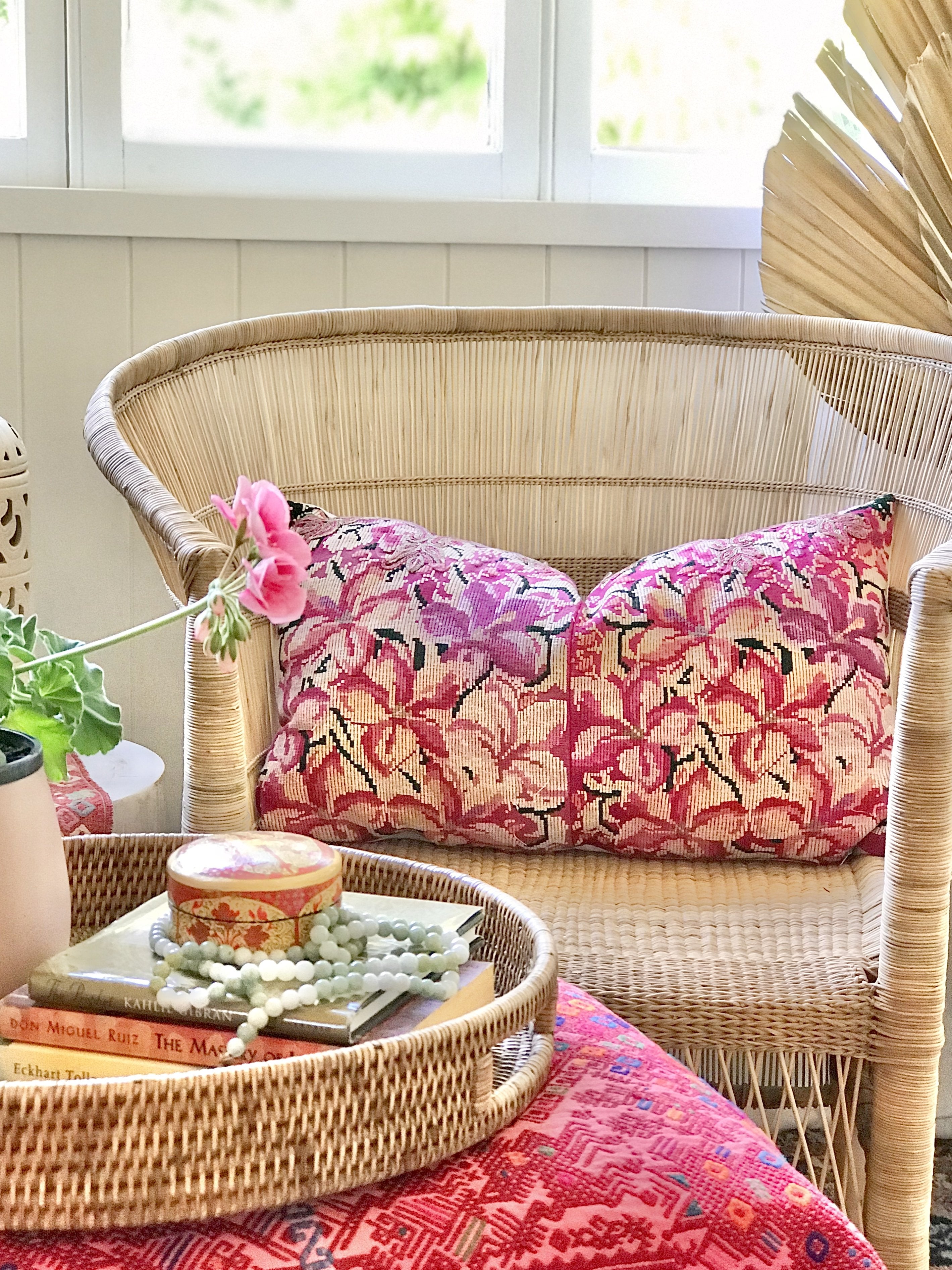 Guatemalan embroidered huipil pillow. A fuchsia vintage textile with an abstract floral design.